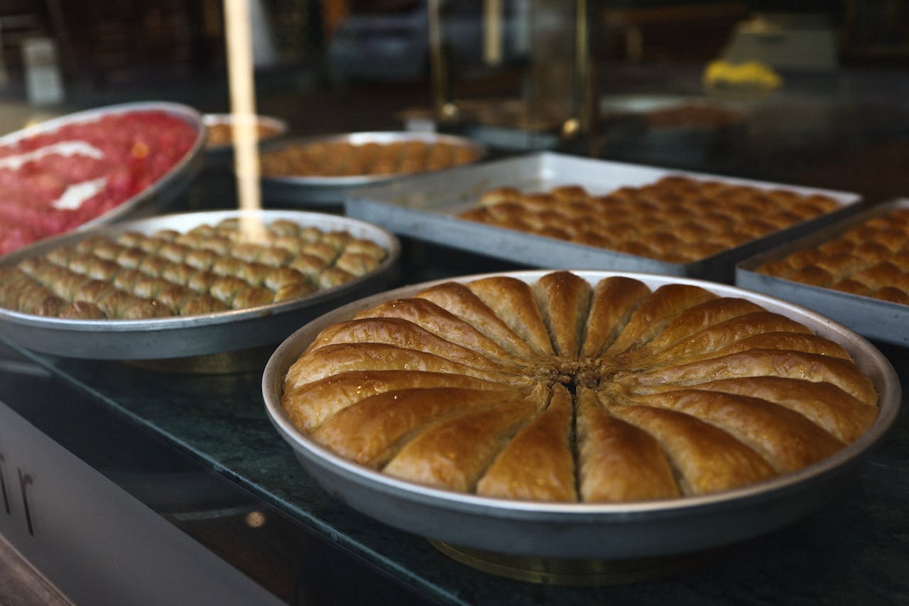 Close-up of various baklava trays on display in a Gaziantep sweet shop, Turkey.